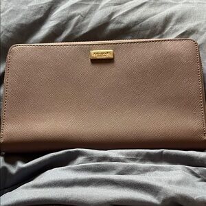 kate spade taupe textured zip-around wallet with gold plaque